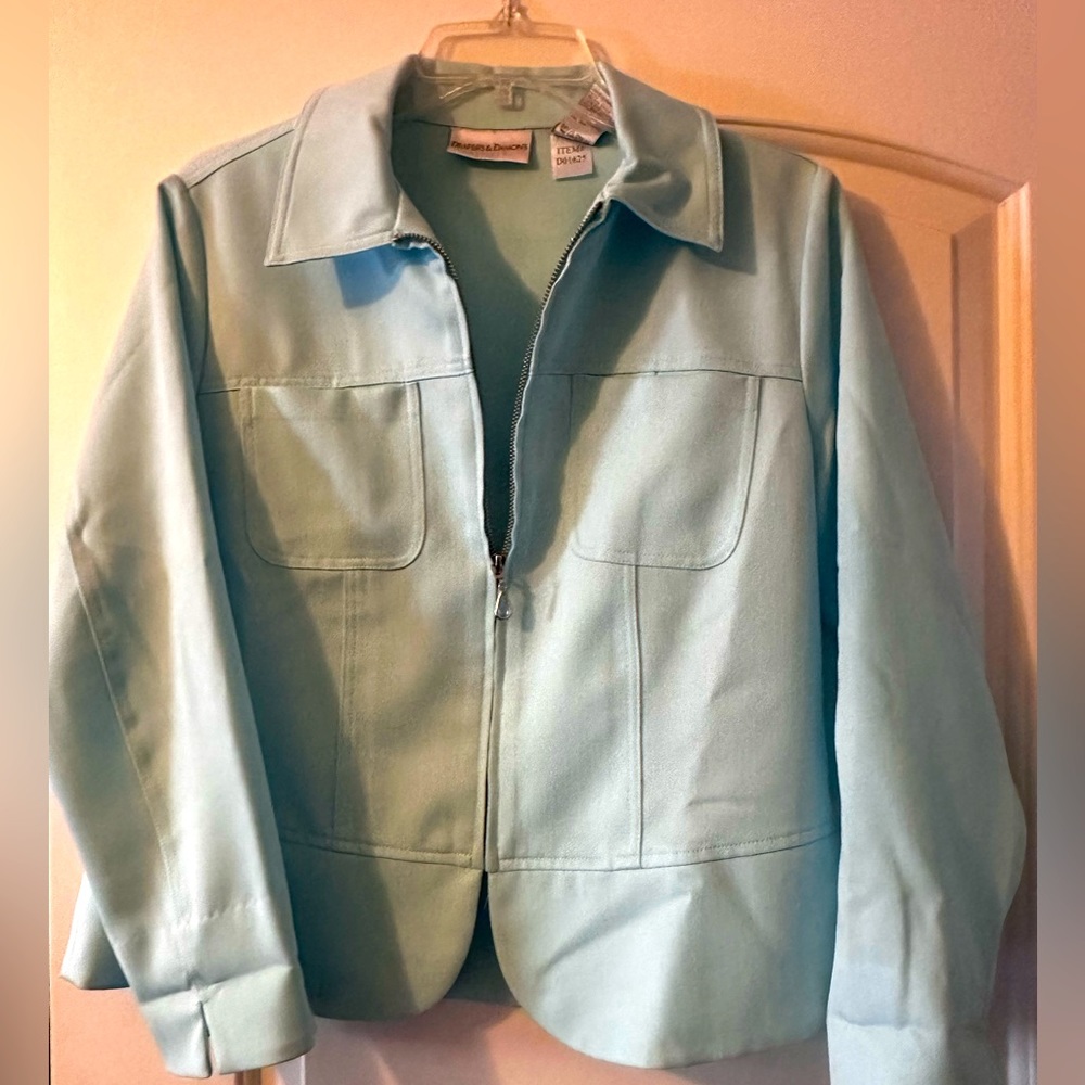 Draper’s and Damon’s mint green women’s blazer with zip front.